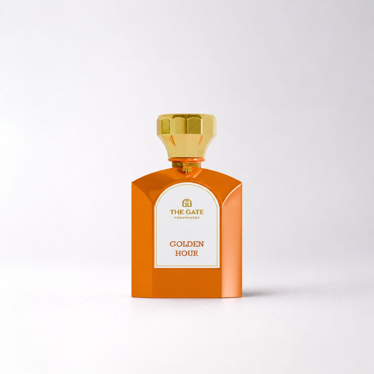 The Gate Golden Hour Eau de Parfum 100 ml – luxuriöser orangefarbener Parfumflakon mit goldfarbenem Verschluss und elegantem Design.